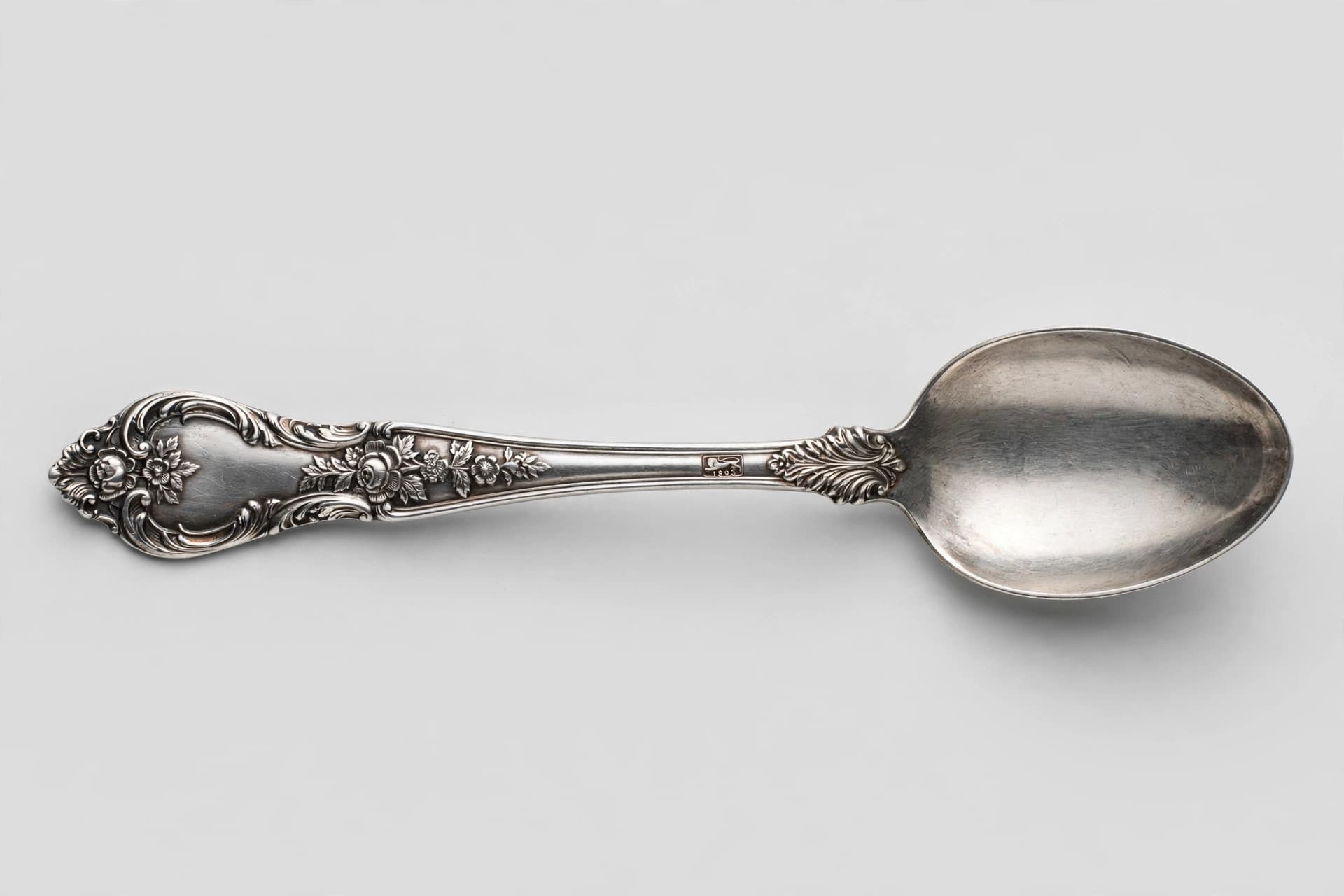 Victorian Silver Teaspoon with Ornate Floral Handle — Primary view
